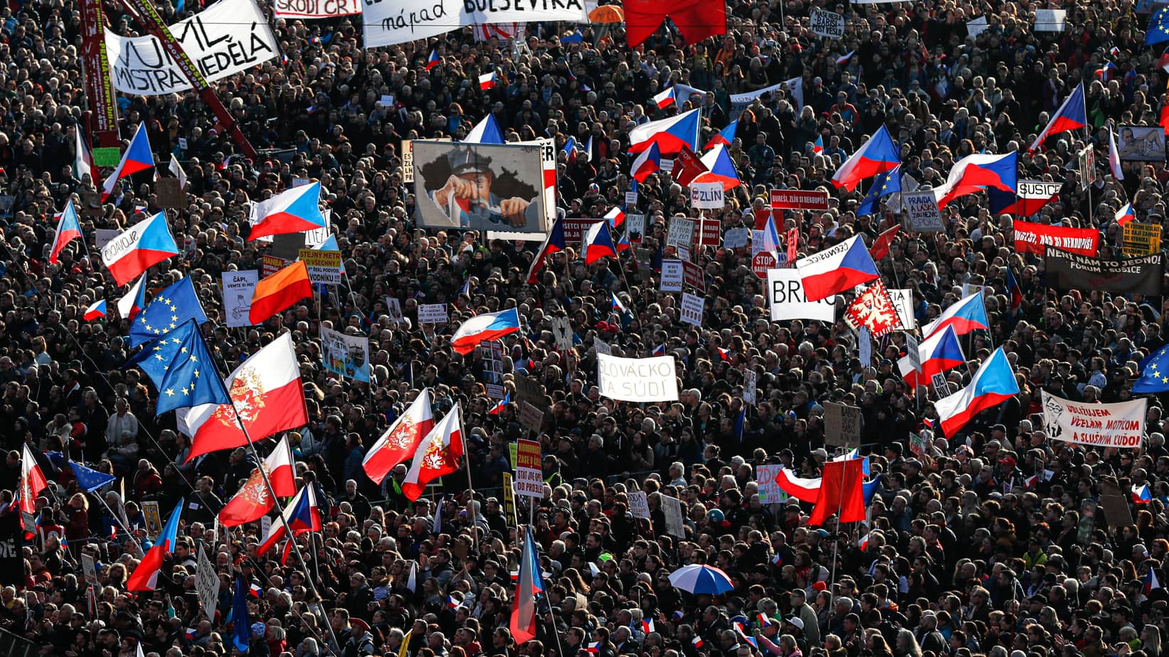People take part in a large anti-government protest in Prague, Czech Republic, Saturday, Nov. 16, 2019.